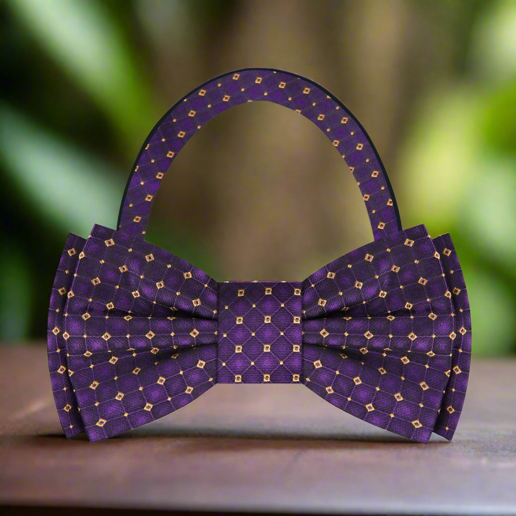 Close-up of the regal purple and gold geometric bow tie showcasing its intricate pattern.
