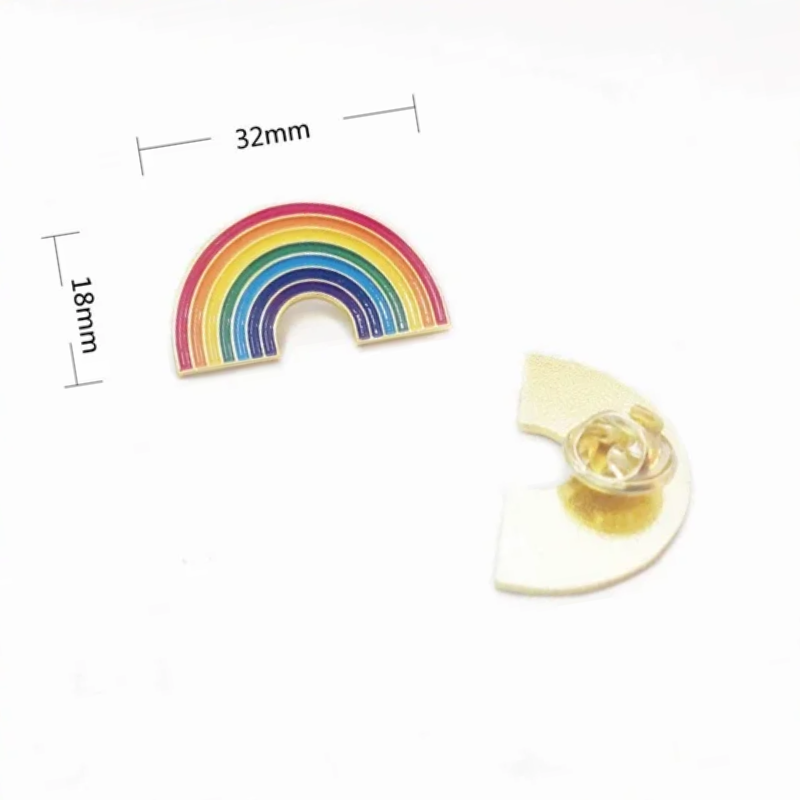 Rainbow pride enamel pin styled on a navy suit lapel for an LGBTQ event