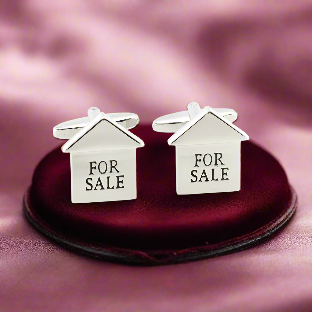 Stylish display of cufflinks with a light blue dress shirt, ideal for business meetings