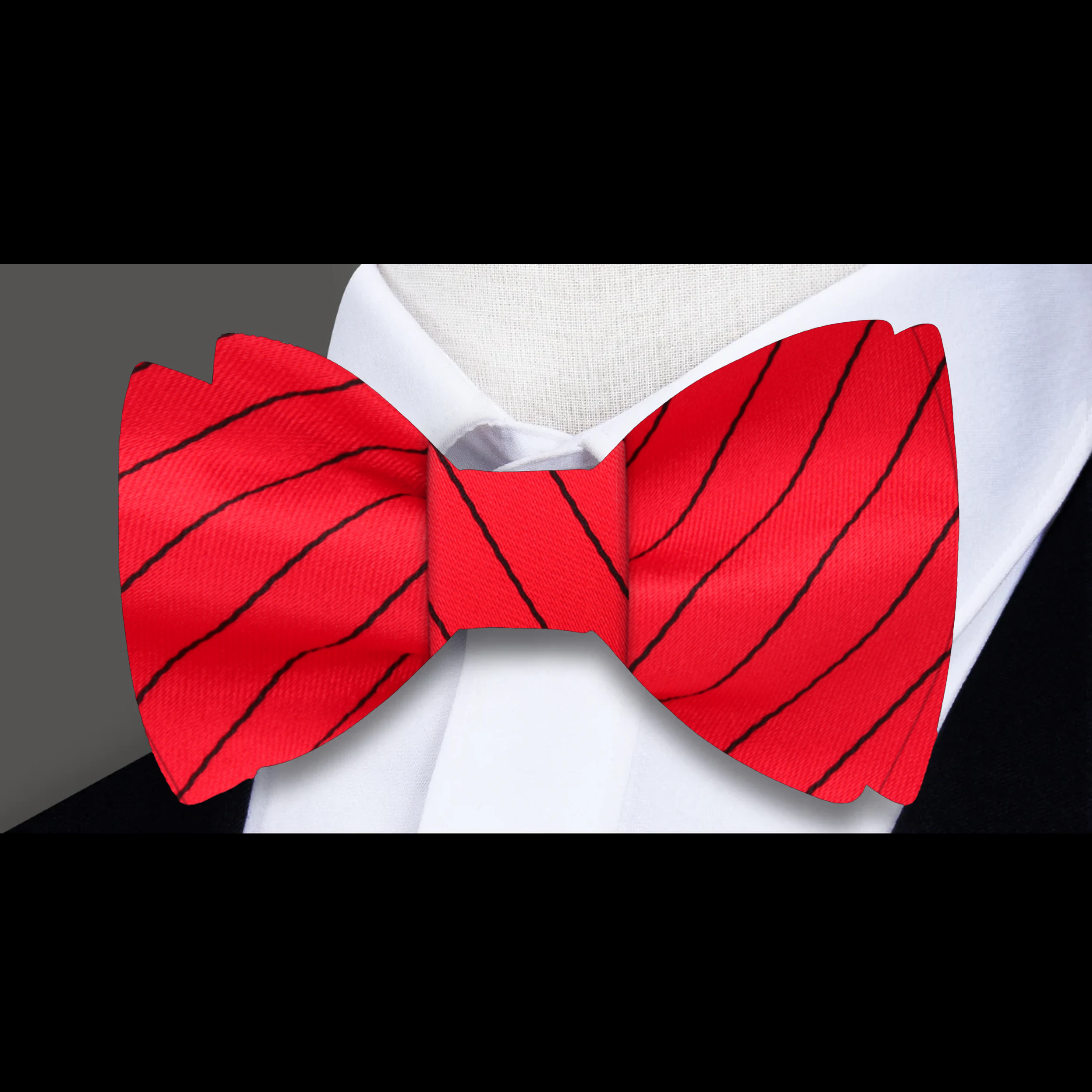 Close-up of a red and black striped bow tie, showcasing its elegant design and silk texture.