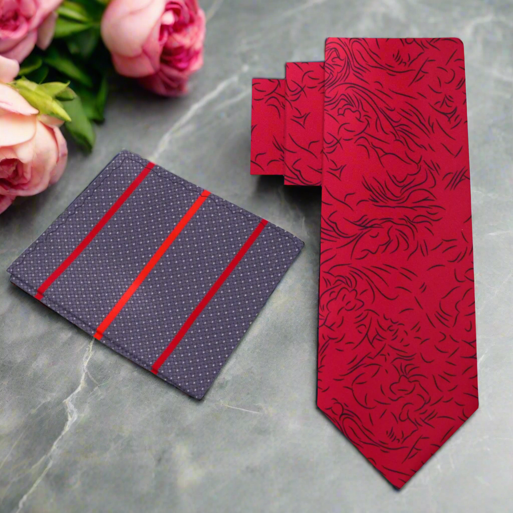 Close-up of red silk necktie with abstract black lines, styled with a white dress shirt