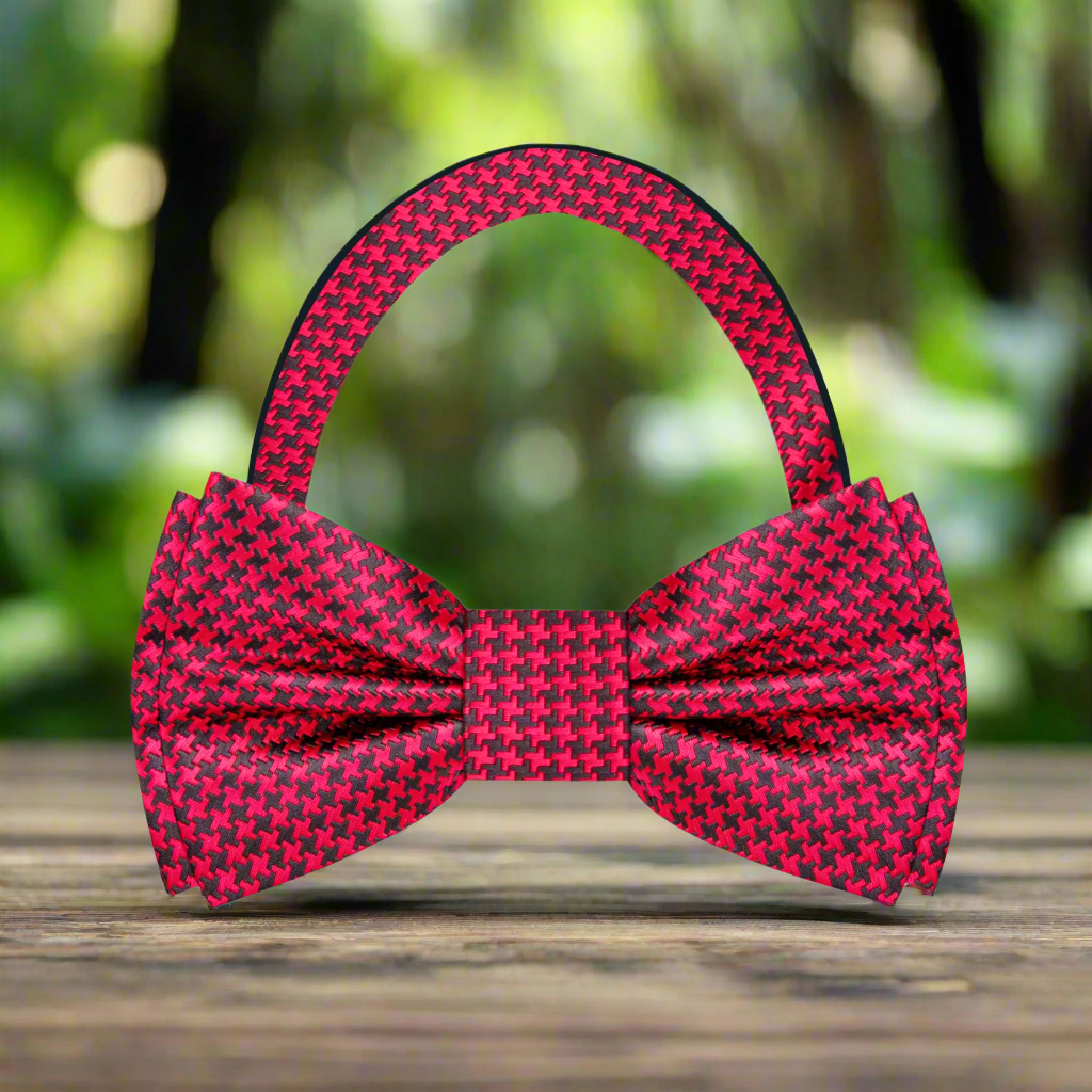 Close-up of a red houndstooth silk bow tie on a dress shirt for formal events