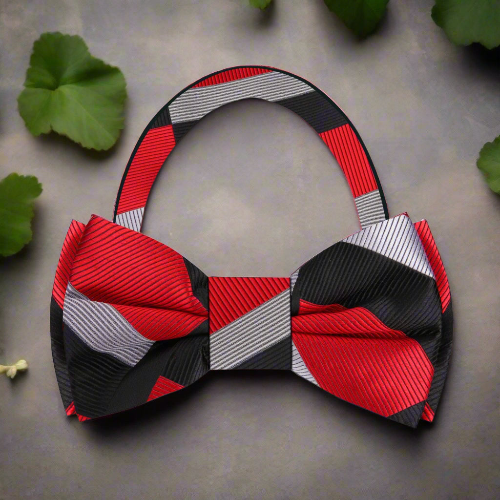 Flat lay of the bow tie and matching pocket square, highlighting the silk texture and bold color combinations