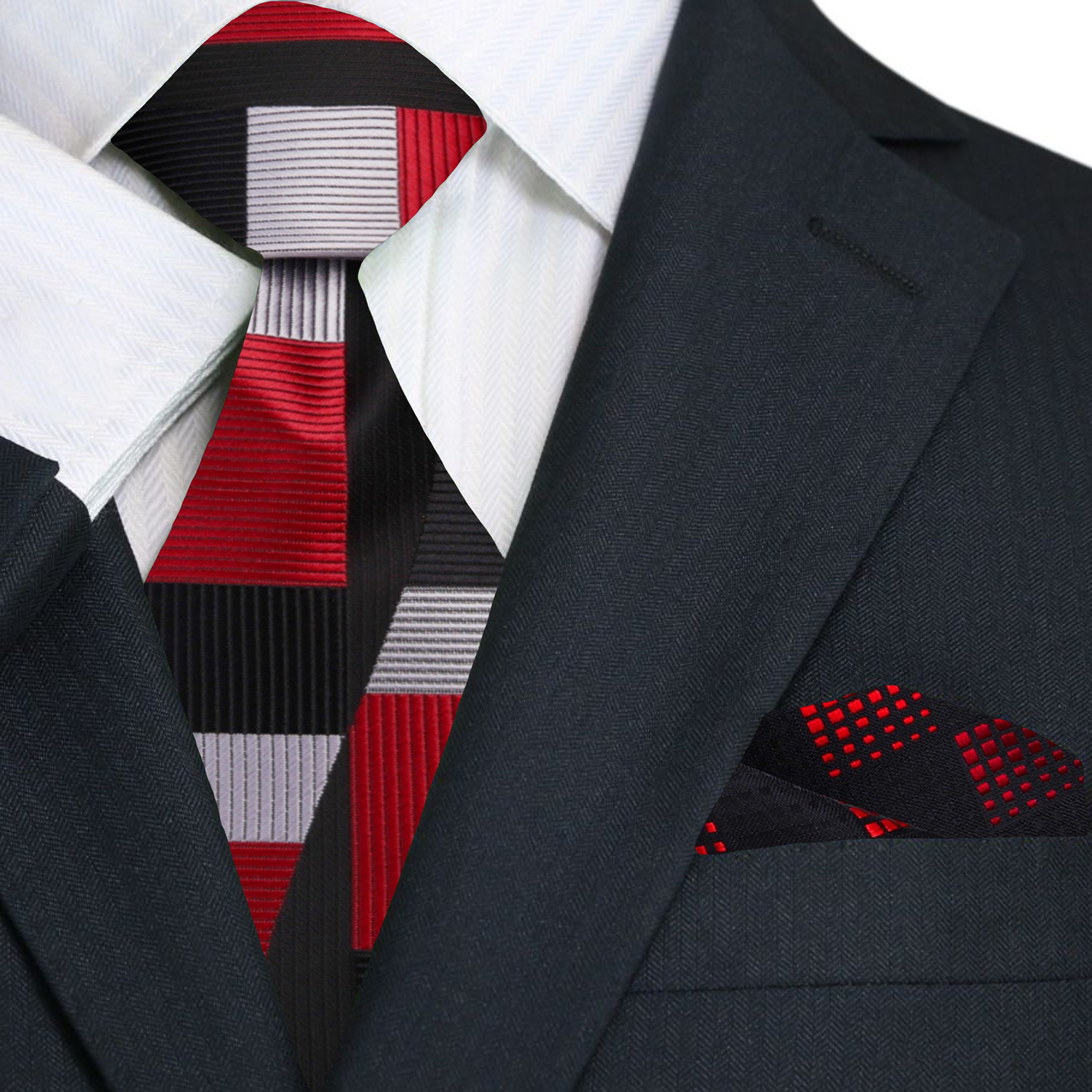 Man wearing the red geometric tie paired with a crisp white dress shirt at a formal event.