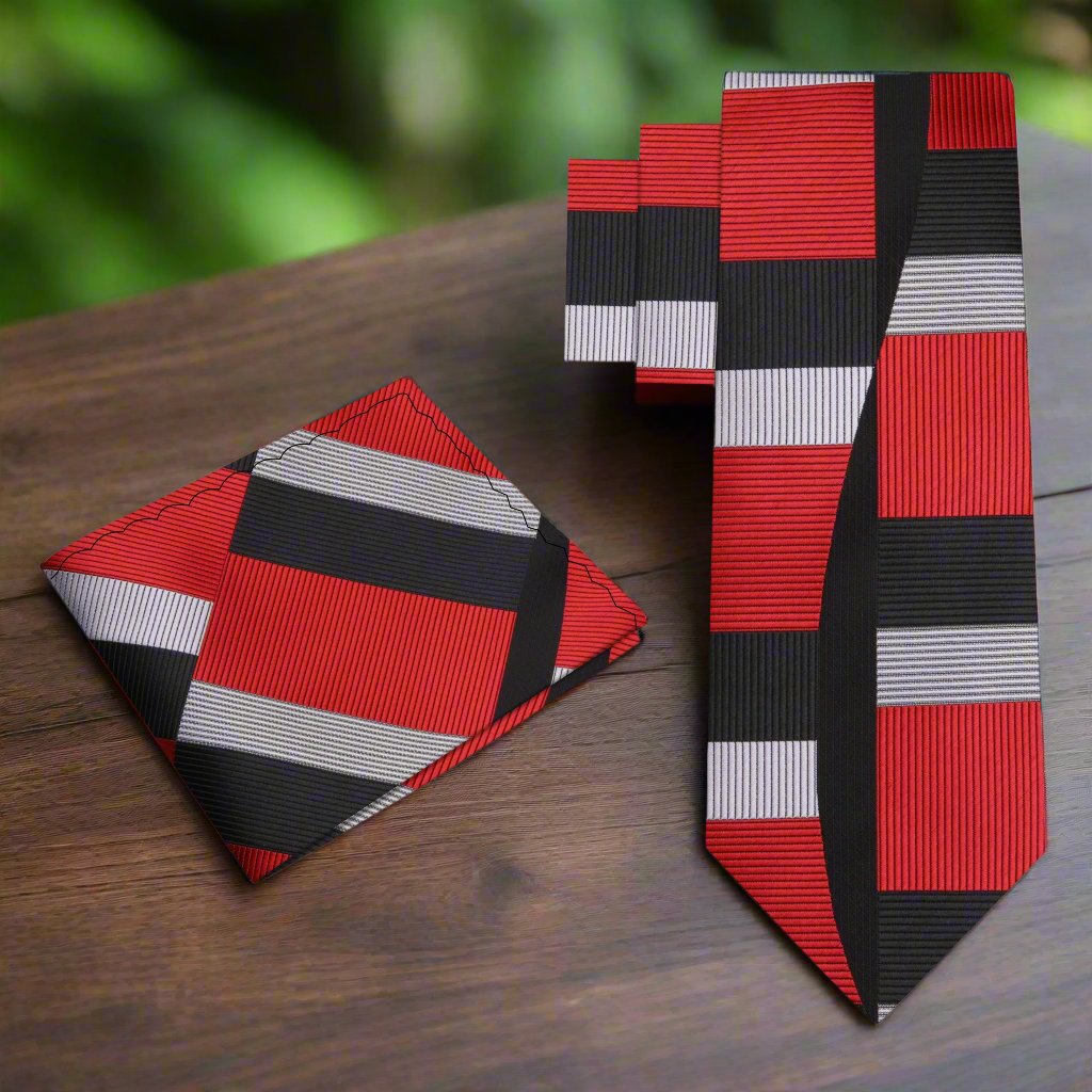 Close-up of the red geometric mens necktie showcasing its intricate pattern.