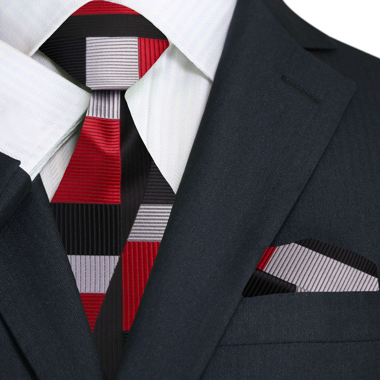 Man wearing the red geometric tie paired with a crisp white dress shirt at a formal event.