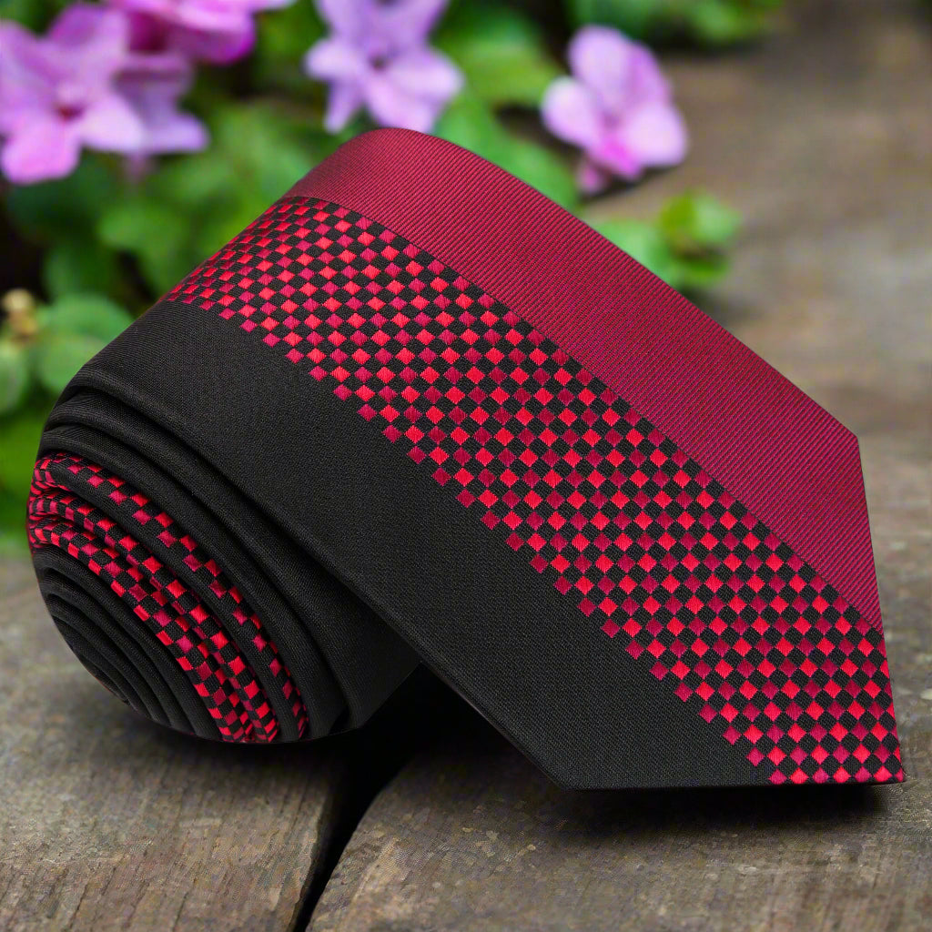 Close-up of the black and red checkered silk necktie, showcasing its exquisite pattern and texture.