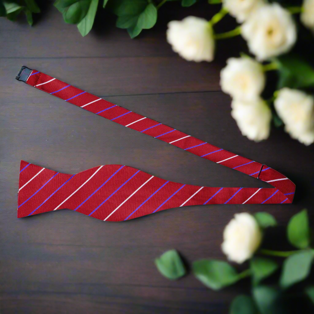 Close-up of a red and black striped bow tie, showcasing its elegant design and silk texture.