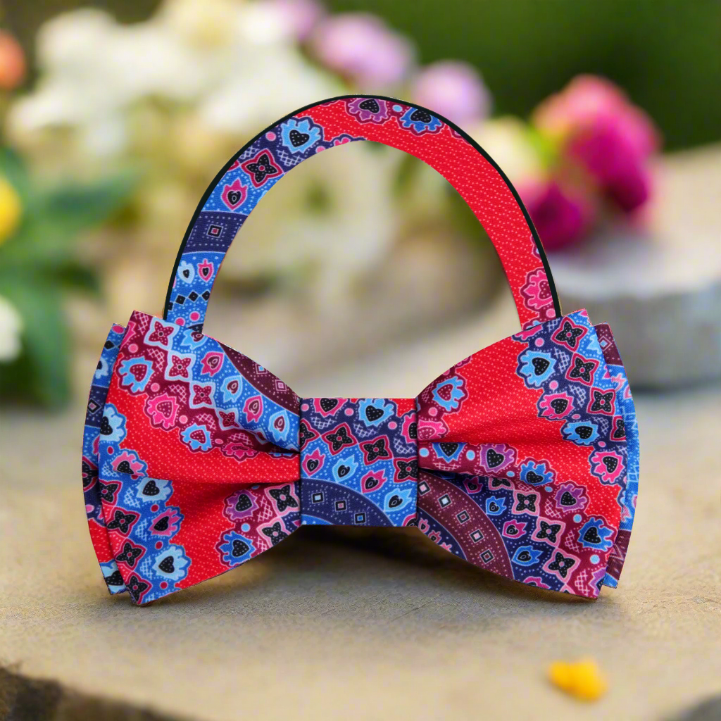 Close-up of a vibrant silk bow tie featuring whimsical patterns, perfect for special occasions