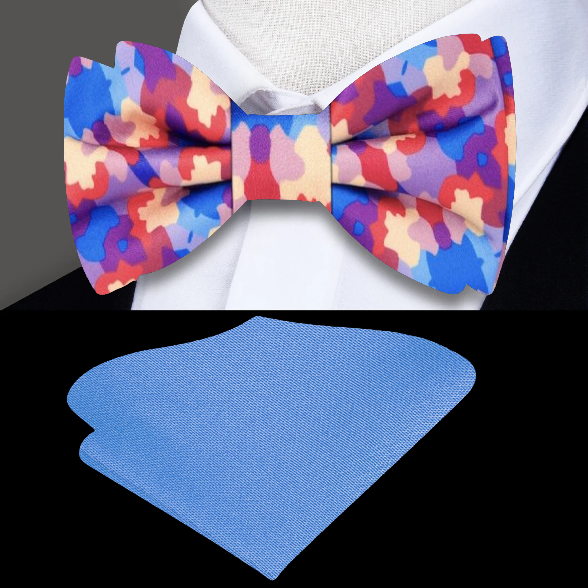 Elegant display of the pastel watercolor silk bow tie alongside a matching pocket square on a formal suit.