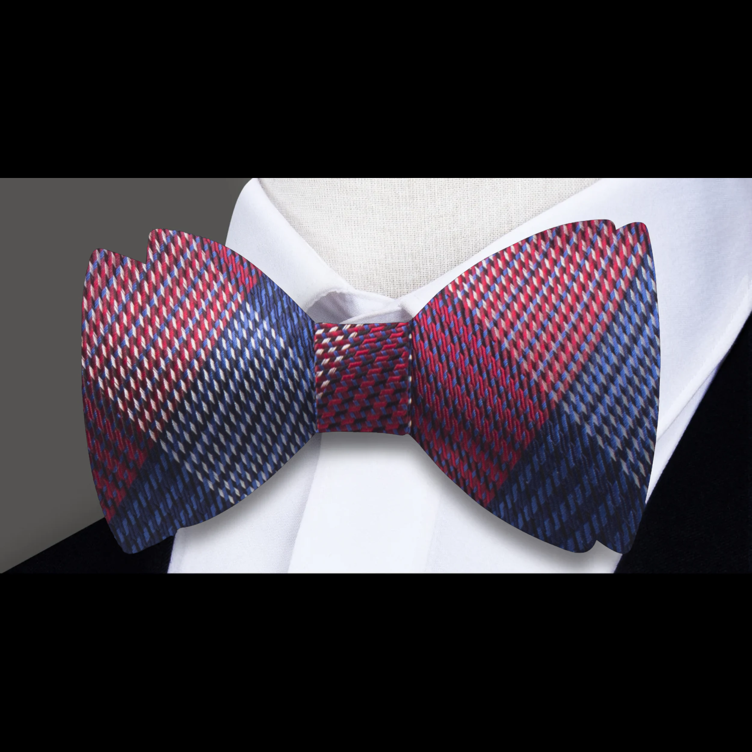 Front view of silk plaid bow tie styled with a dress shirt and suit
