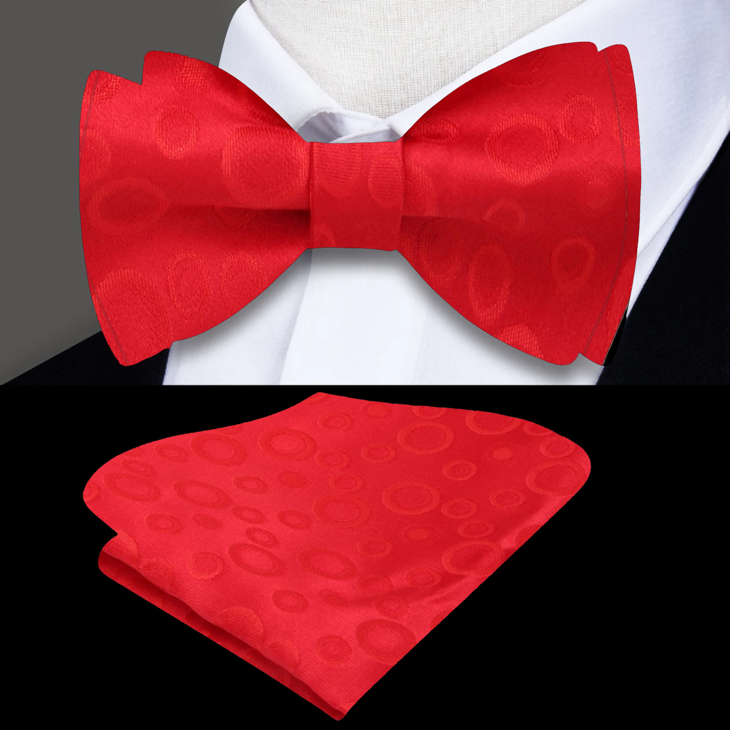 Model wearing a bright red polka dot bow tie paired with a white dress shirt for a formal event.