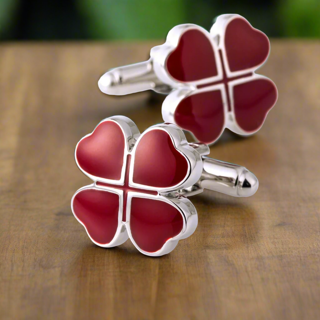 Chrome cufflinks with reddish-brown clovers, ideal for weddings.