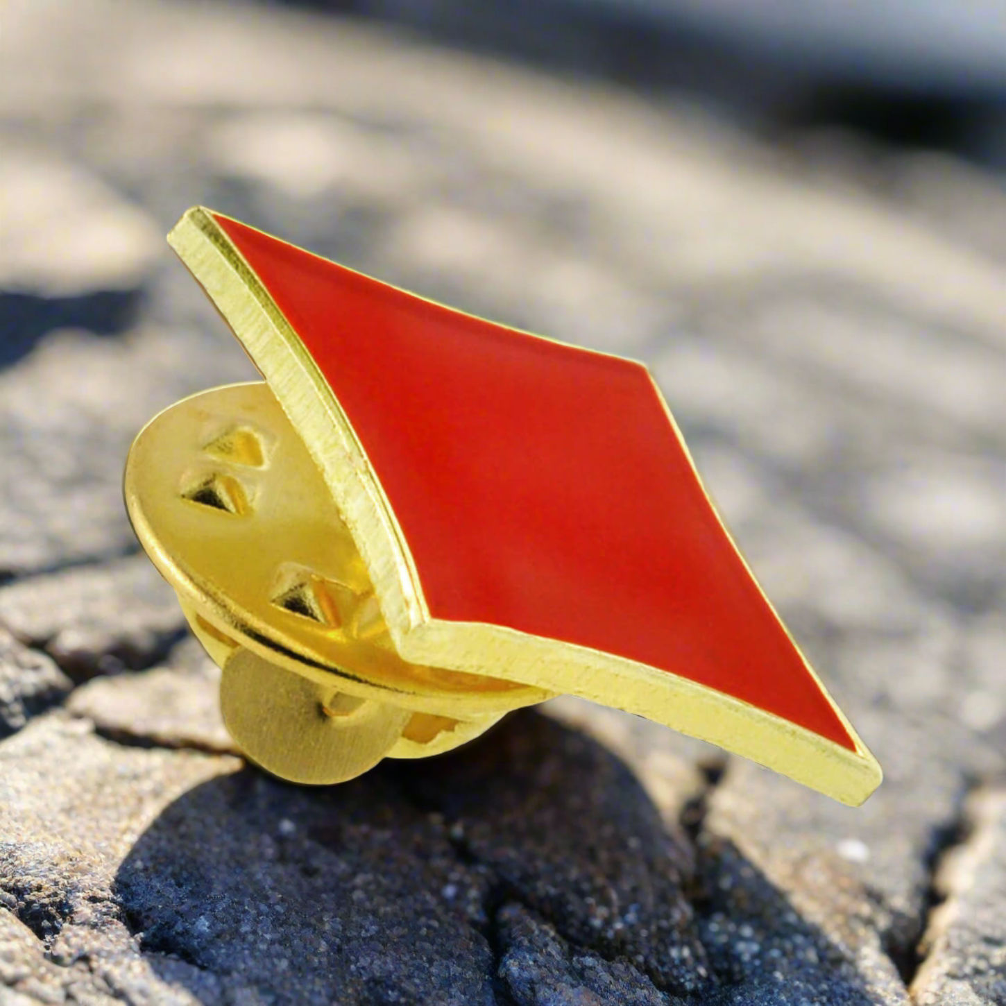 Diamond lapel pin displayed on a light grey dress shirt with a sophisticated touch.