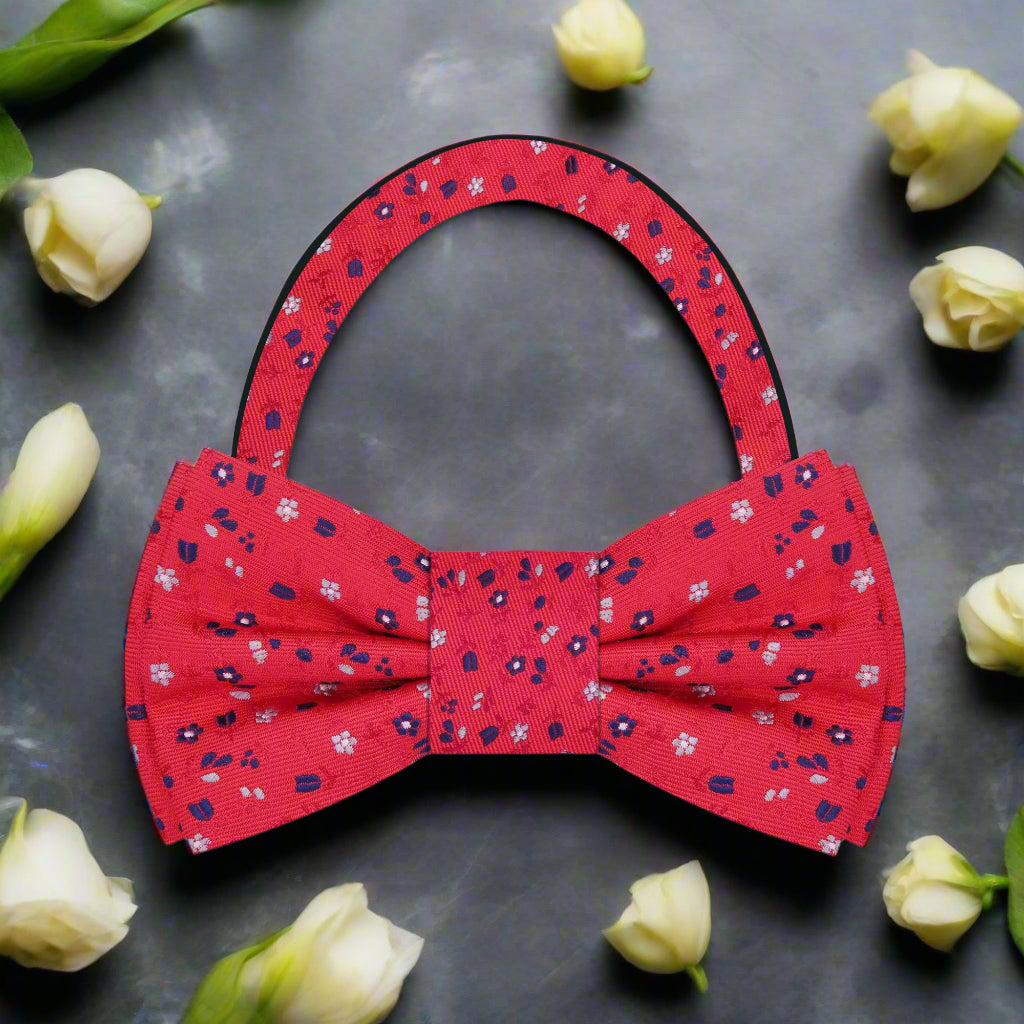 Front view of the floral bow tie with small flower pattern in red, white, and blue