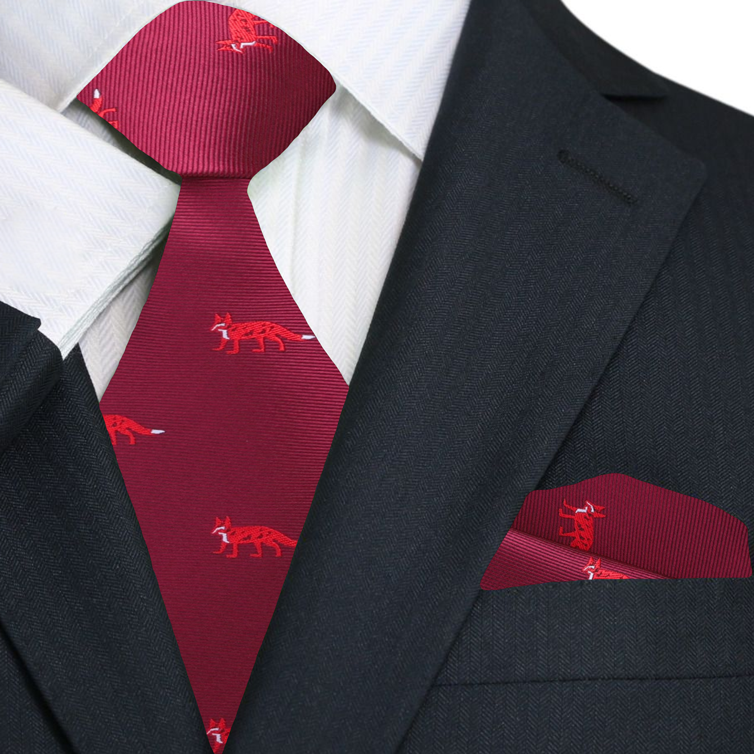 The red silk necktie paired with a crisp white dress shirt, highlighting its elegant design.