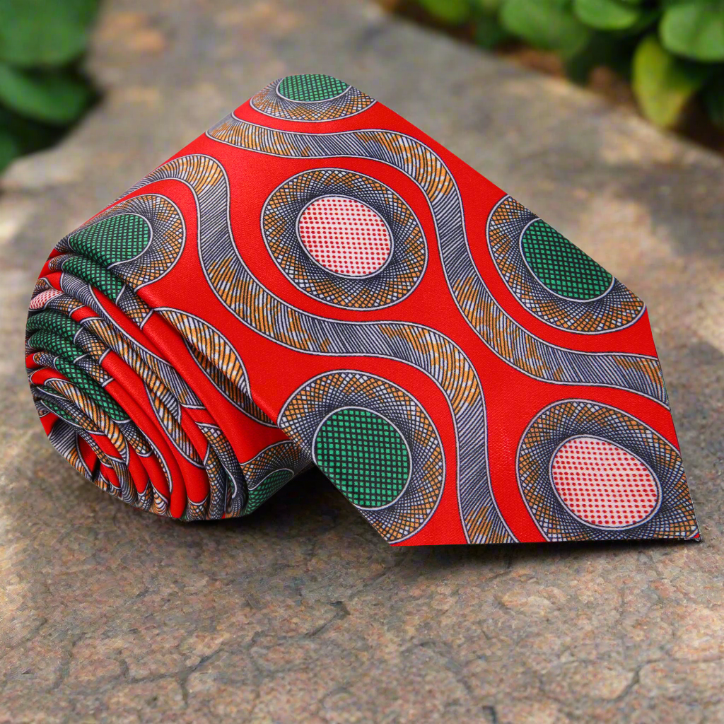 Vibrant red silk tie showcasing an abstract design, ideal for formal events.