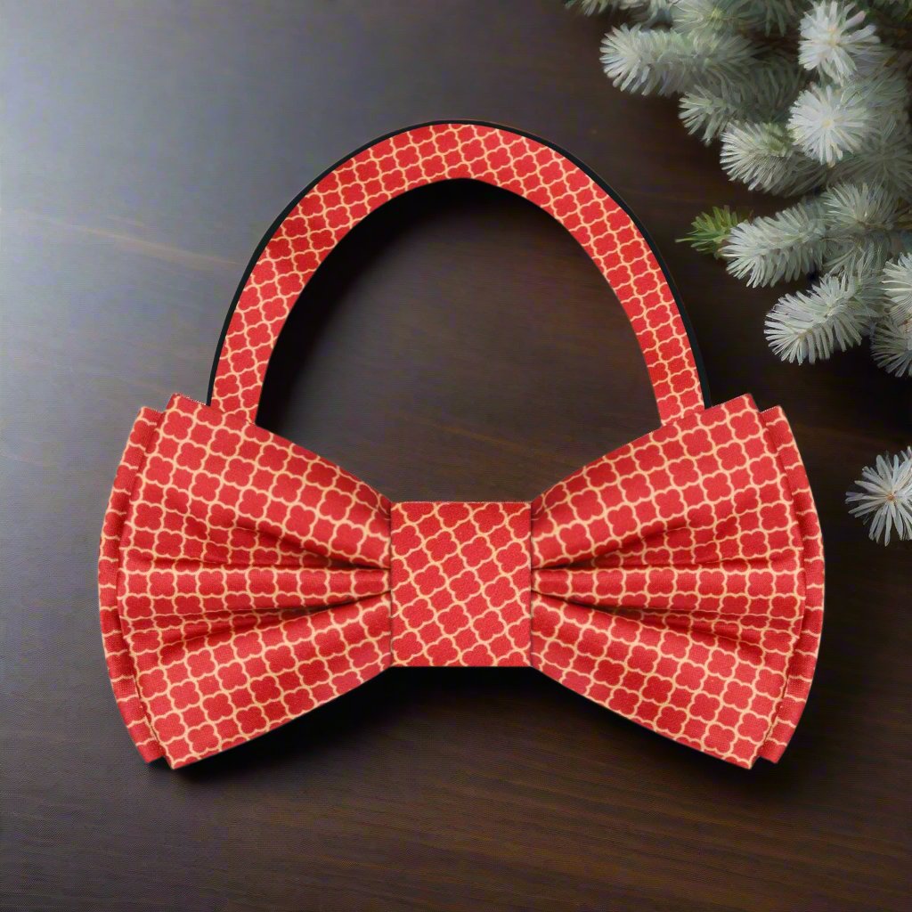 Close-up of a pre-tied gold pattern bow tie for weddings