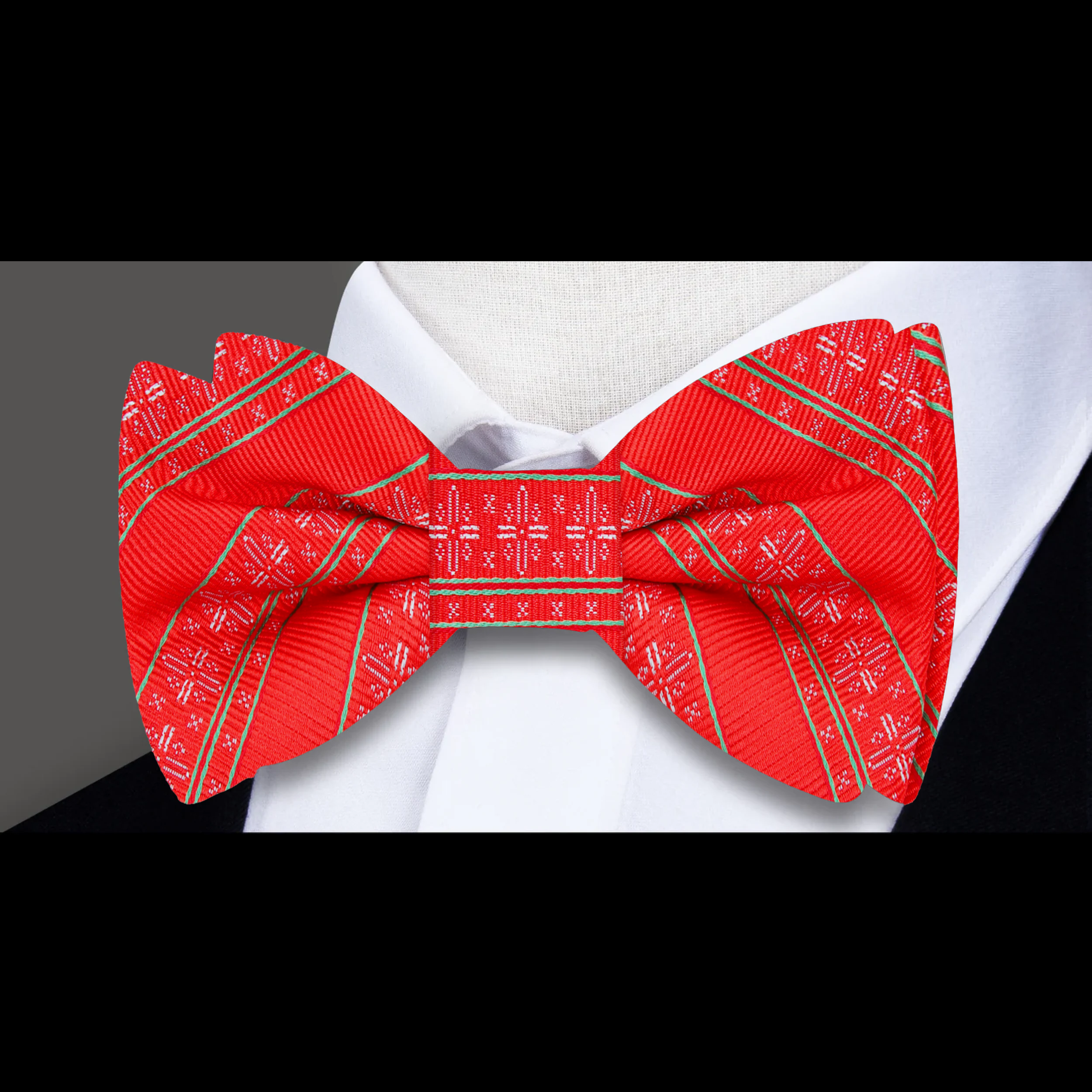 Festive silk snowflake bow tie displayed on a white shirt