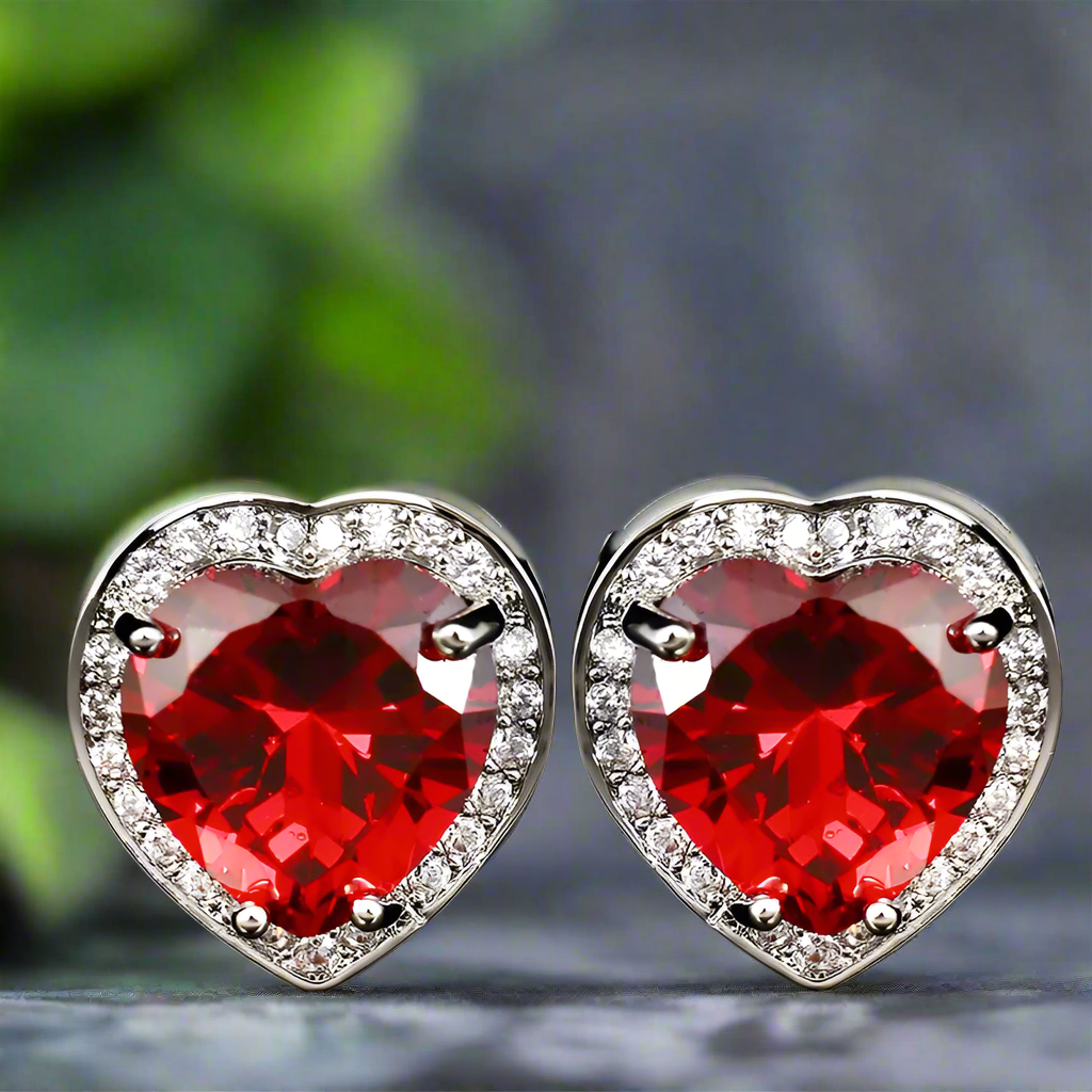 Heart-shaped cufflinks in chrome finish resting on a dress shirt cuff