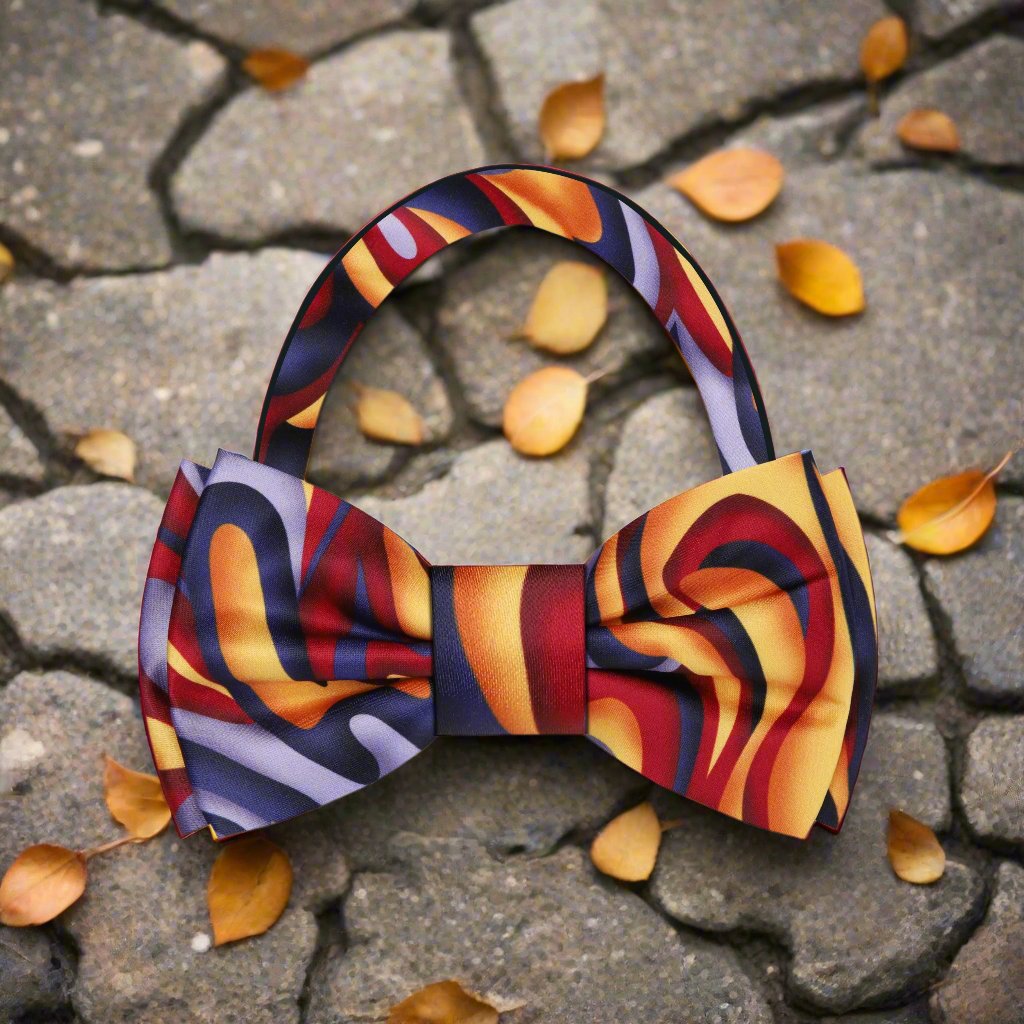 Close-up view of the vibrant abstract bow tie against a crisp white dress shirt.