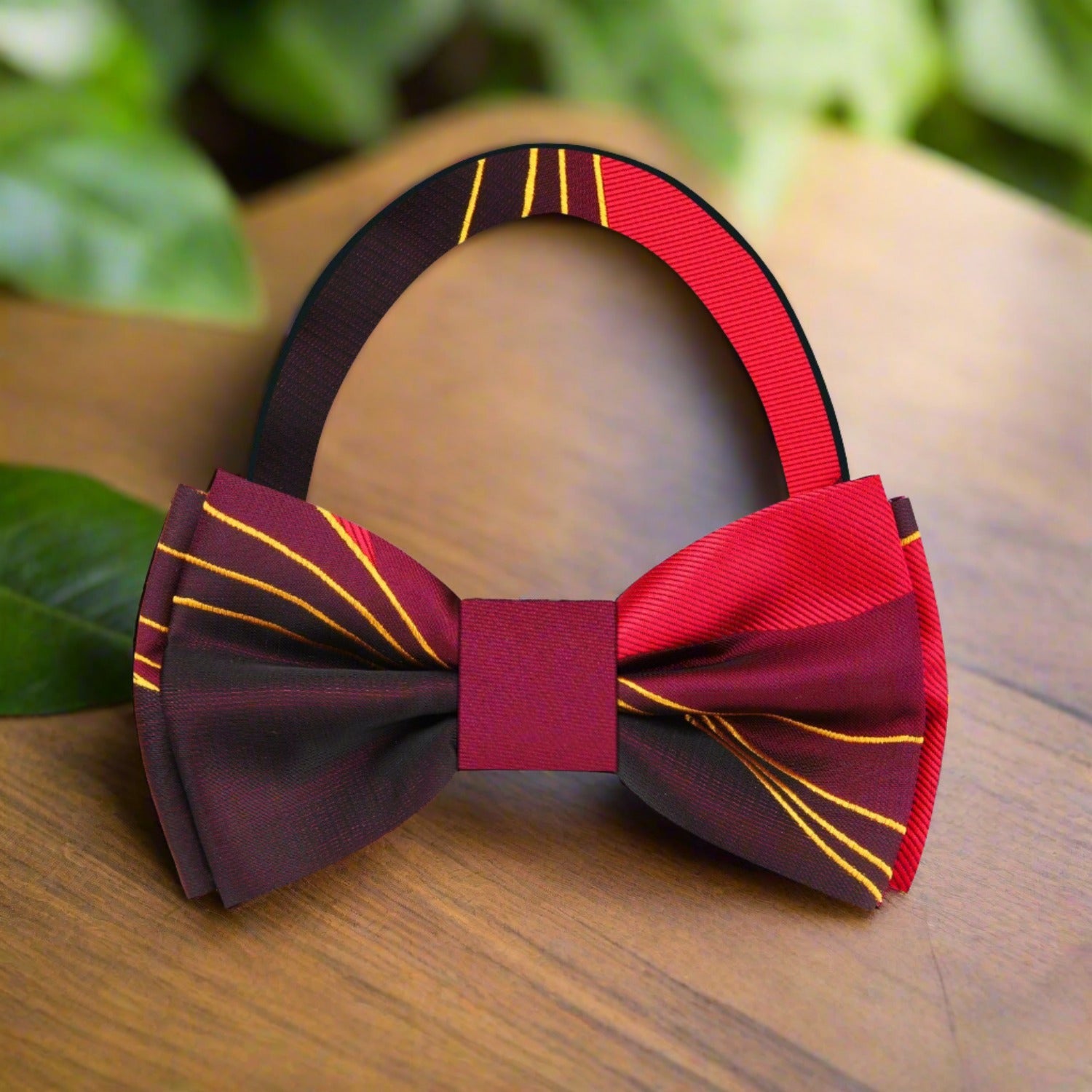 Elegant brown abstract silk bow tie displayed against a white shirt, showcasing its intricate pattern.