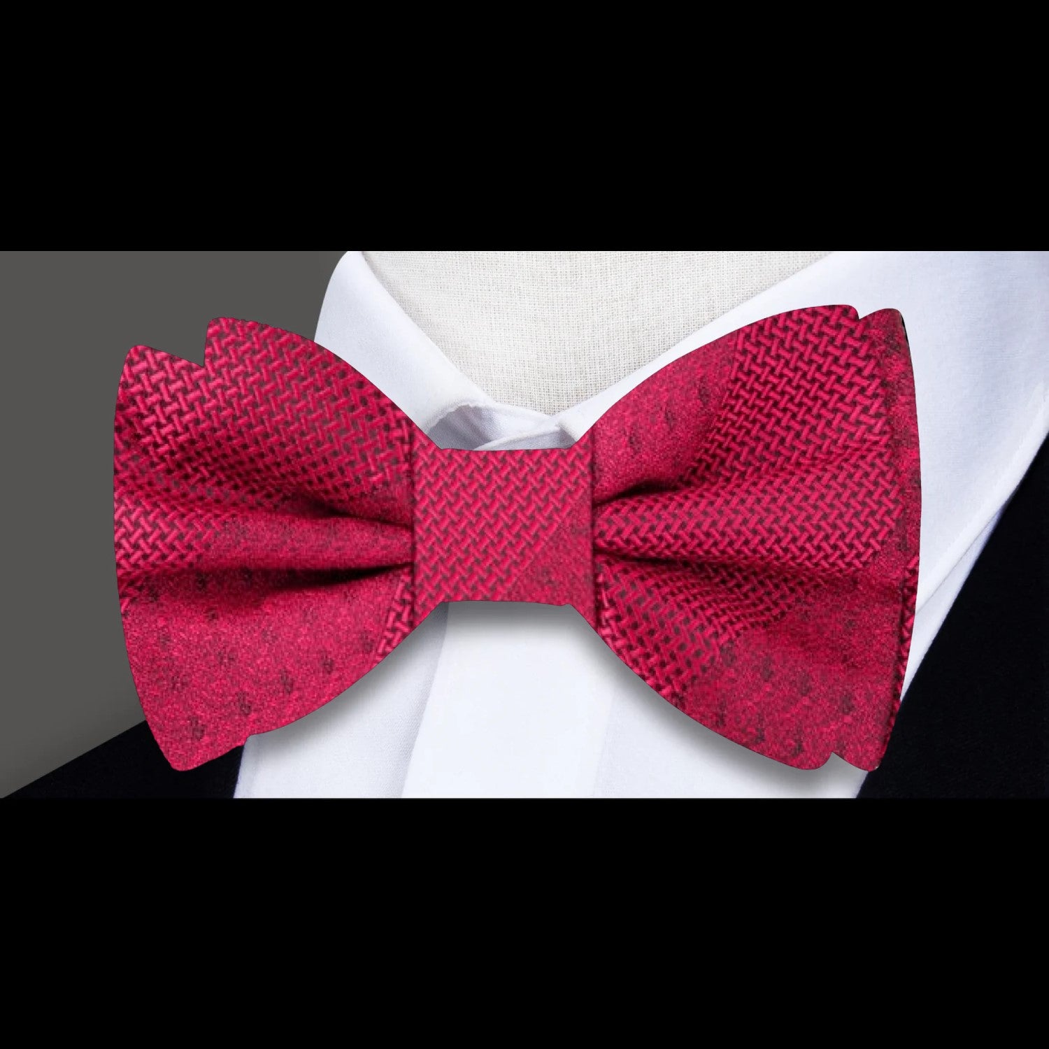 Elegant red bow tie styled with navy blazer and khaki pants