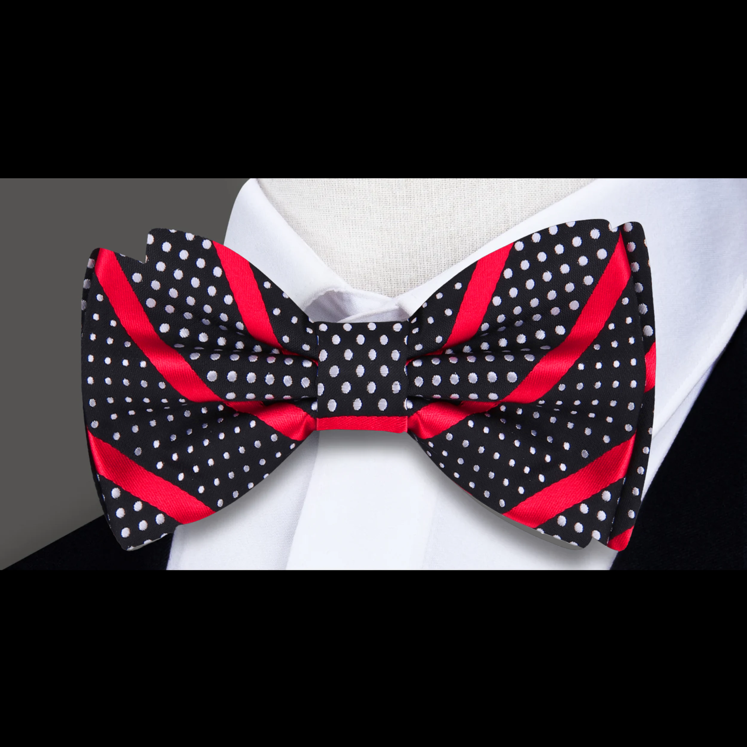 Chic striped polka dot bow tie in vibrant colors, styled with a white dress shirt.