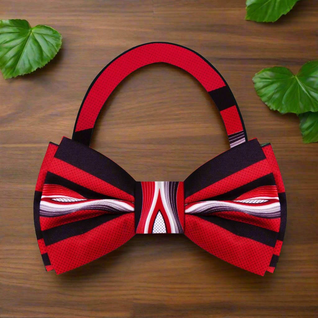 Abstract Waves Silk Bow Tie on display, showcasing the vibrant red, black, and grey colors