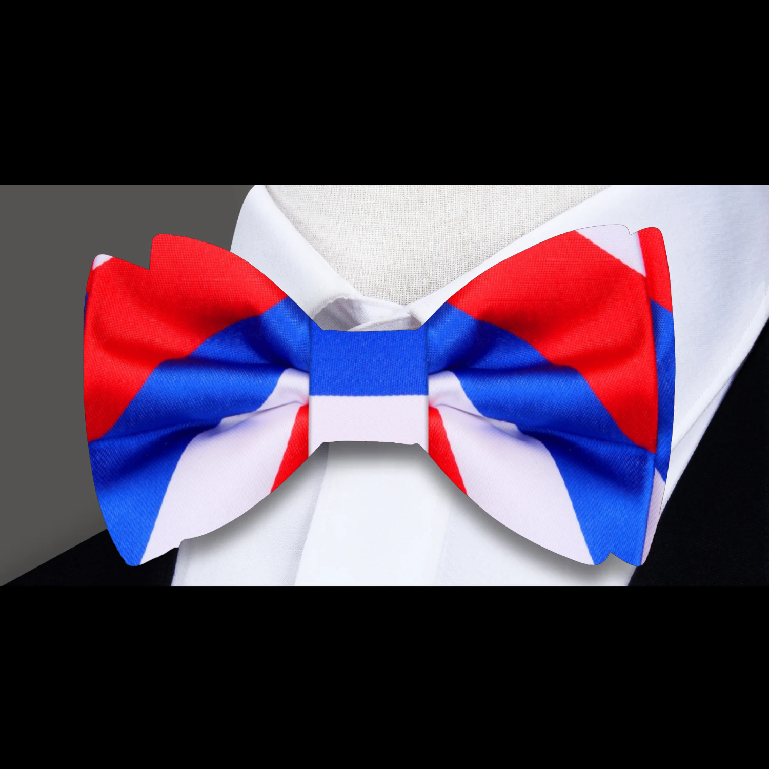 Patriotic bow tie paired with a white dress shirt and navy suit, perfect for weddings and formal occasions.