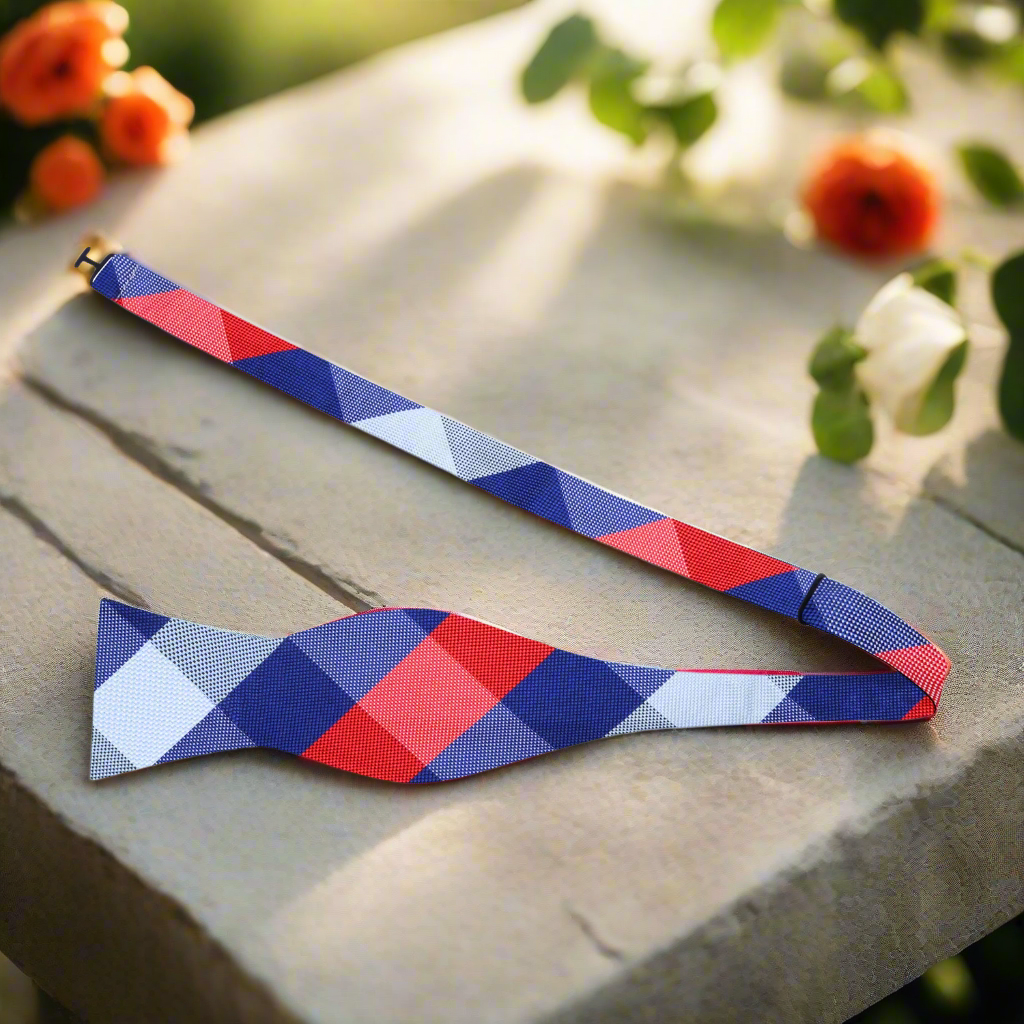 Close-up of a stylish mens plaid bow tie with a self-tie knot, perfect for weddings