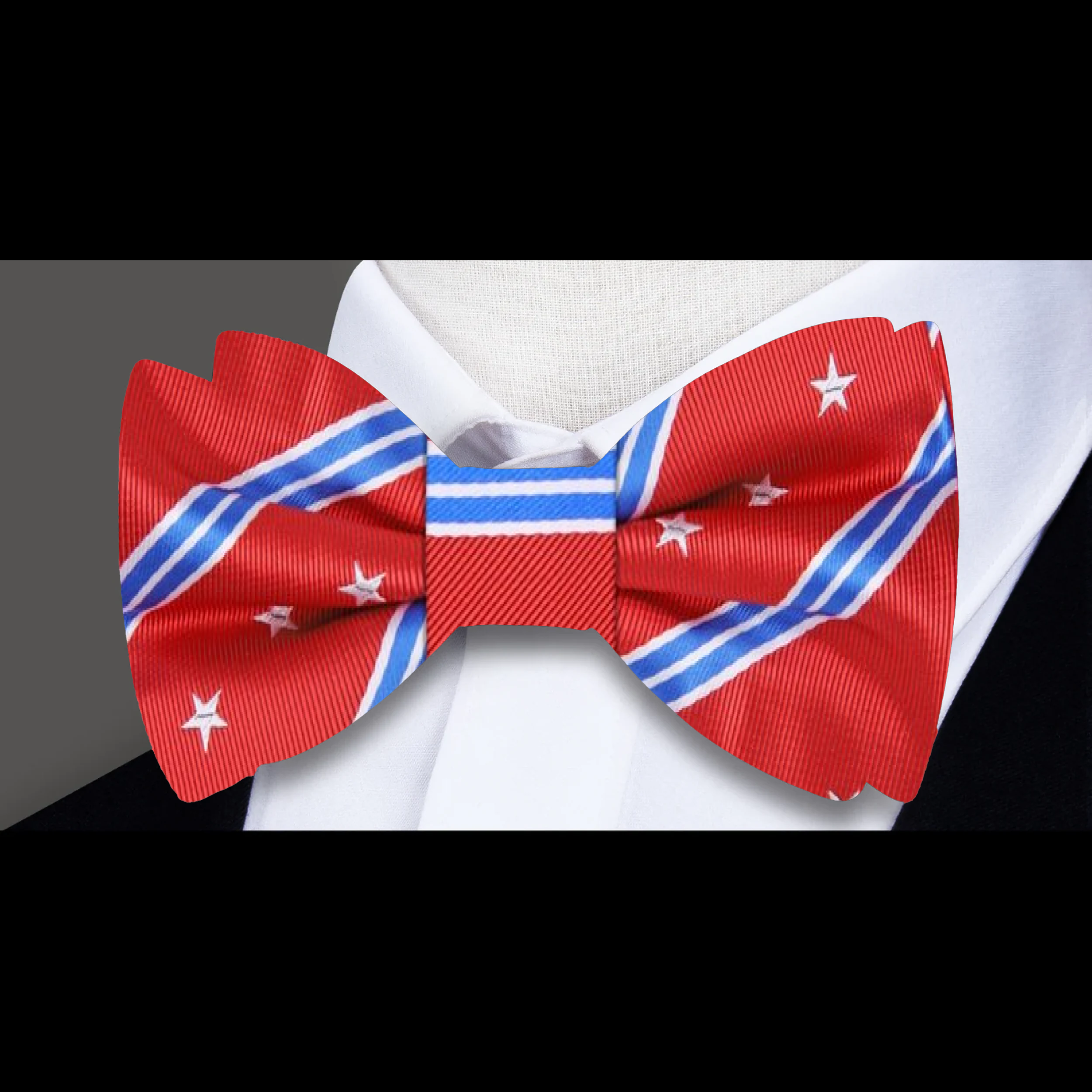 Close-up of a patriotic silk bow tie with stars and stripes pattern