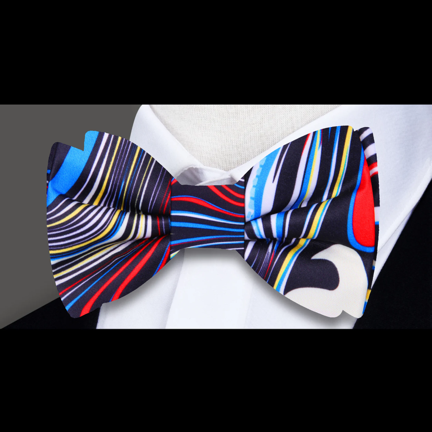 Model wearing the stylish silk bow tie at a cocktail party, highlighting its vibrant colors.