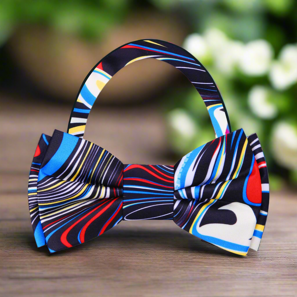 Elegant silk bow tie paired with a navy suit, demonstrating its versatility for formal events.