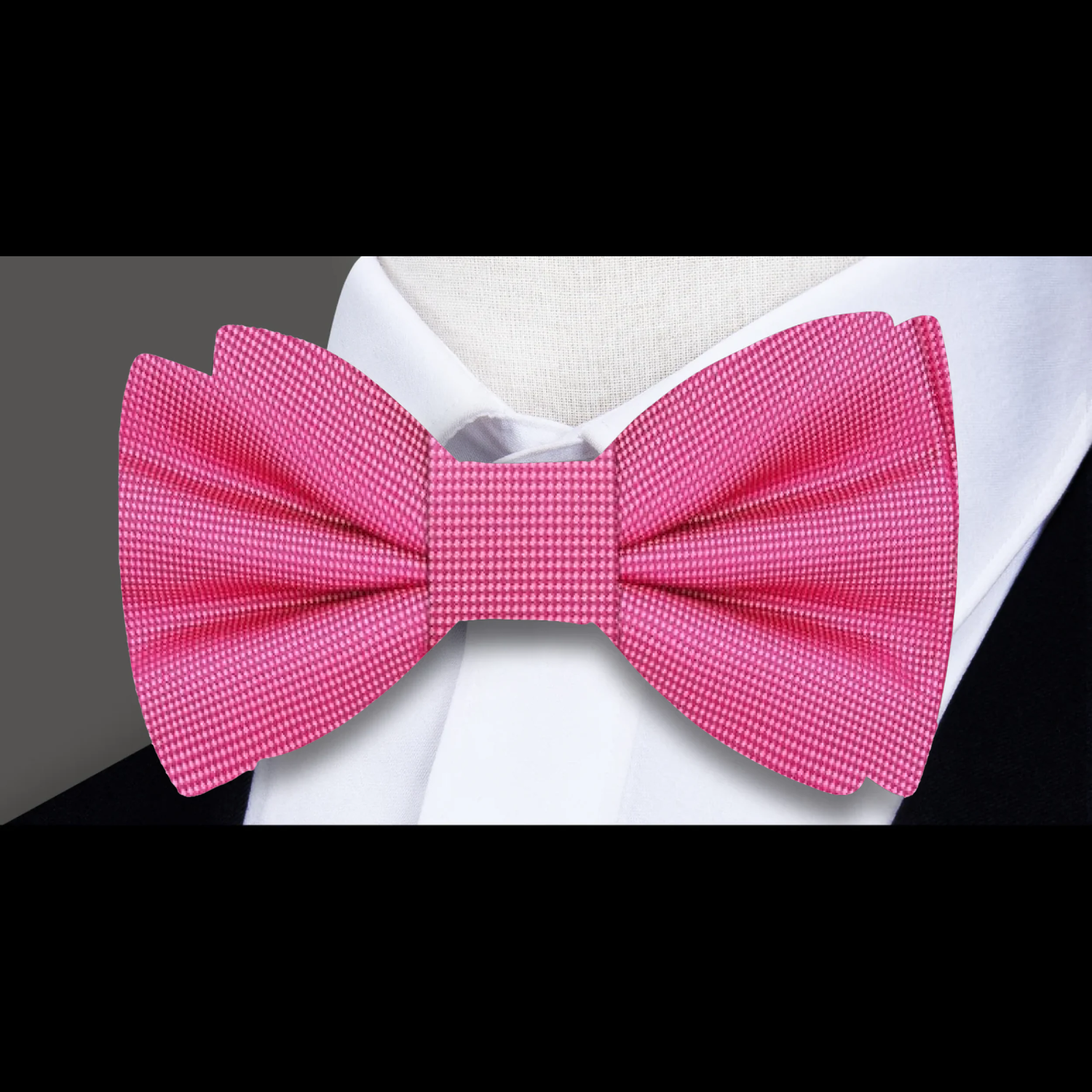 Self-tie bow tie in classic black, suited for tuxedos.