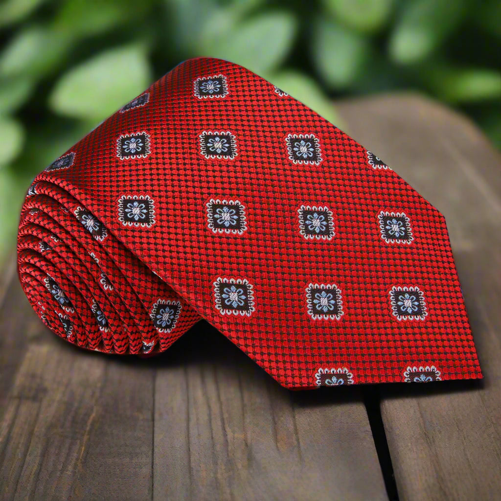 Close-up view of the silk medallion tie, highlighting the intricate patterns and luxurious fabric, ideal for formal occasions.