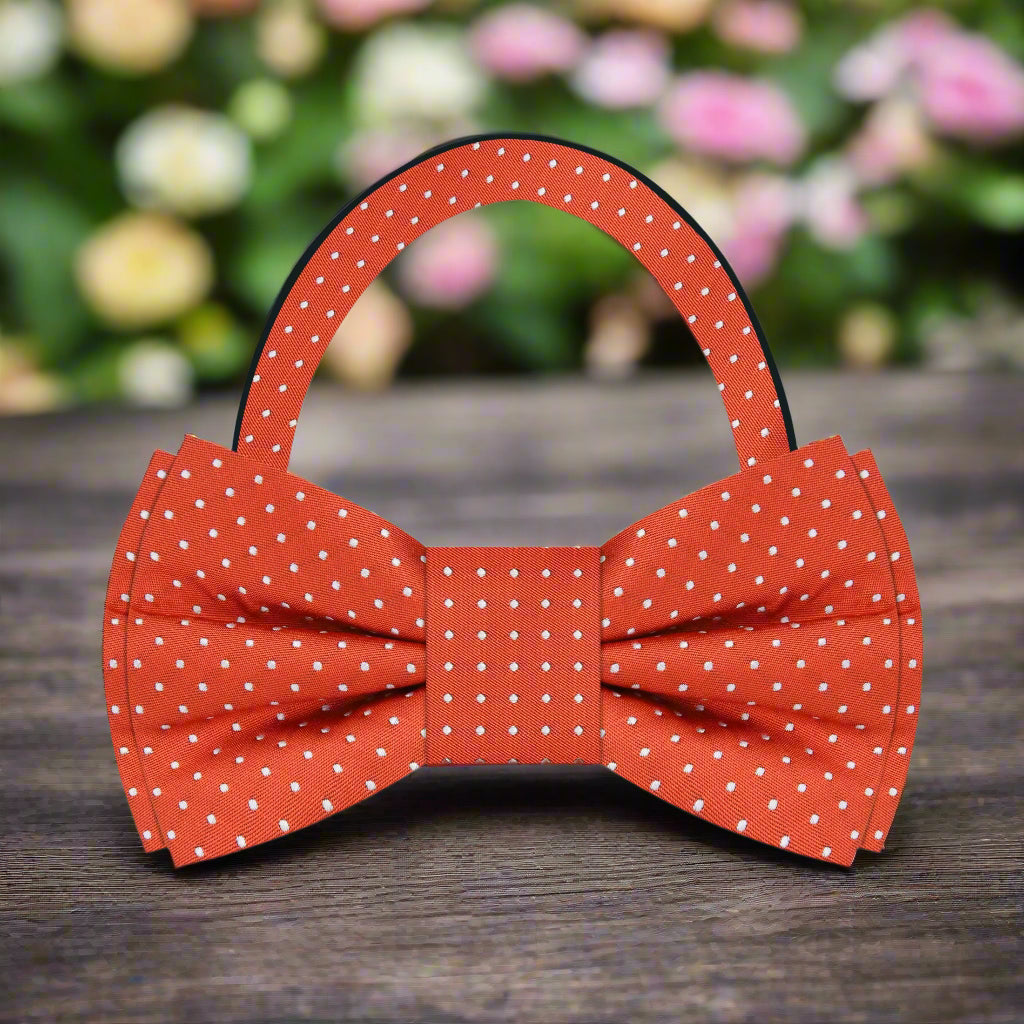 Bow tie worn with a navy blue suit at a wedding event.