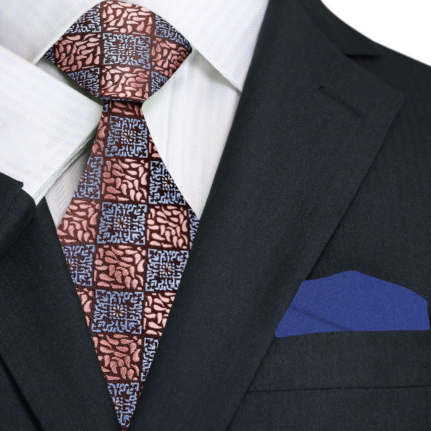 Model wearing the rose gold geometric necktie paired with a navy suit.