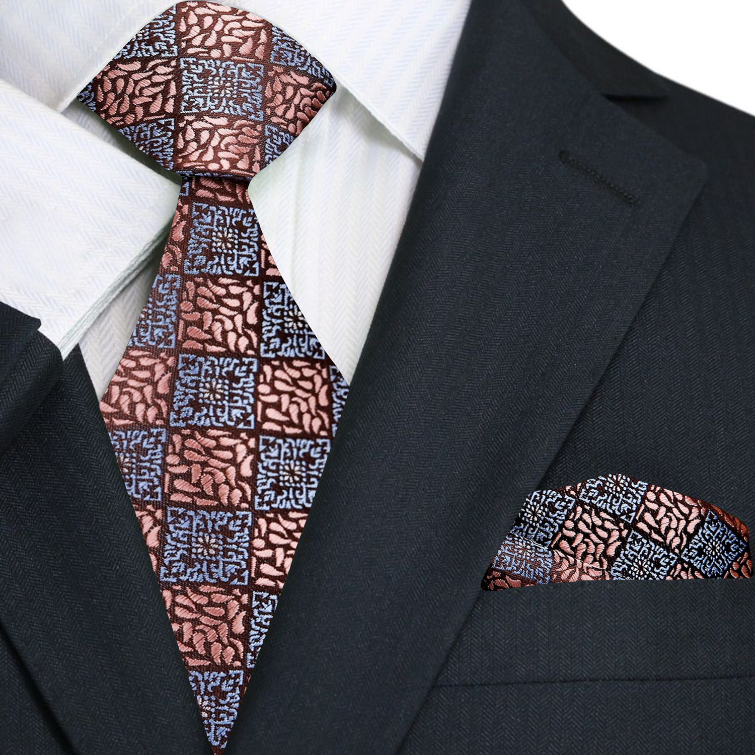 Model wearing the rose gold geometric necktie paired with a navy suit.