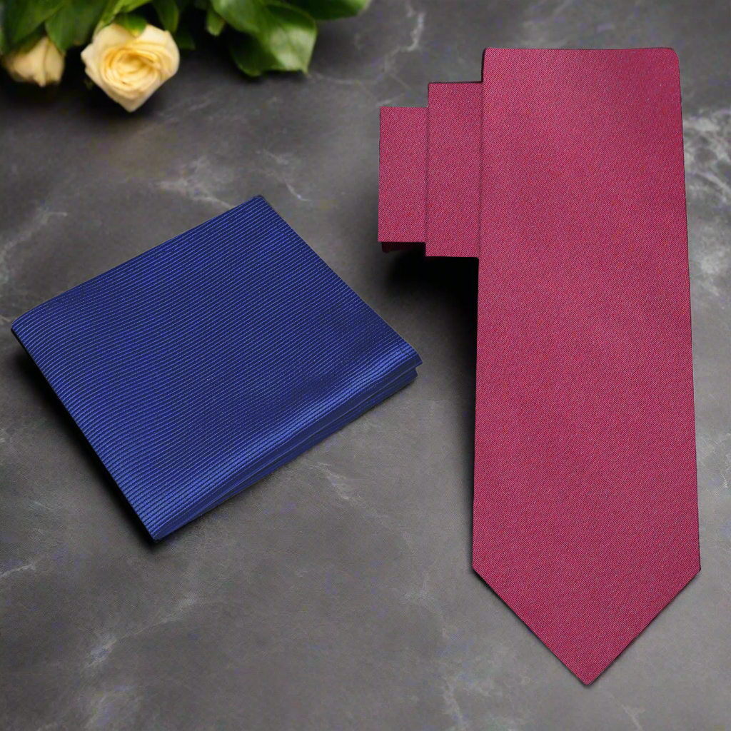Classic deep red silk necktie draped elegantly over a suit jacket, showcasing its rich color.