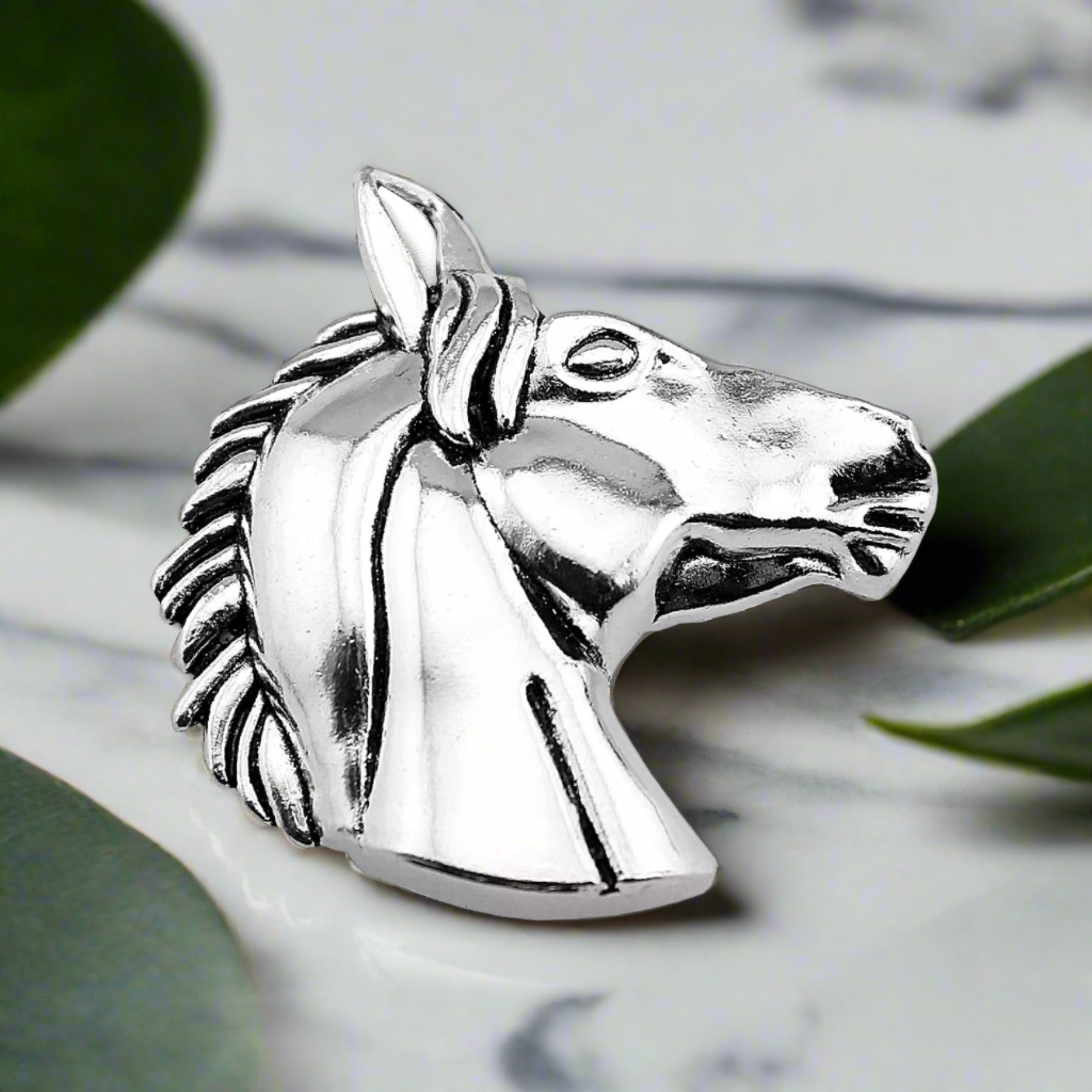 Horse head lapel pin paired with a white dress shirt for a classic look.