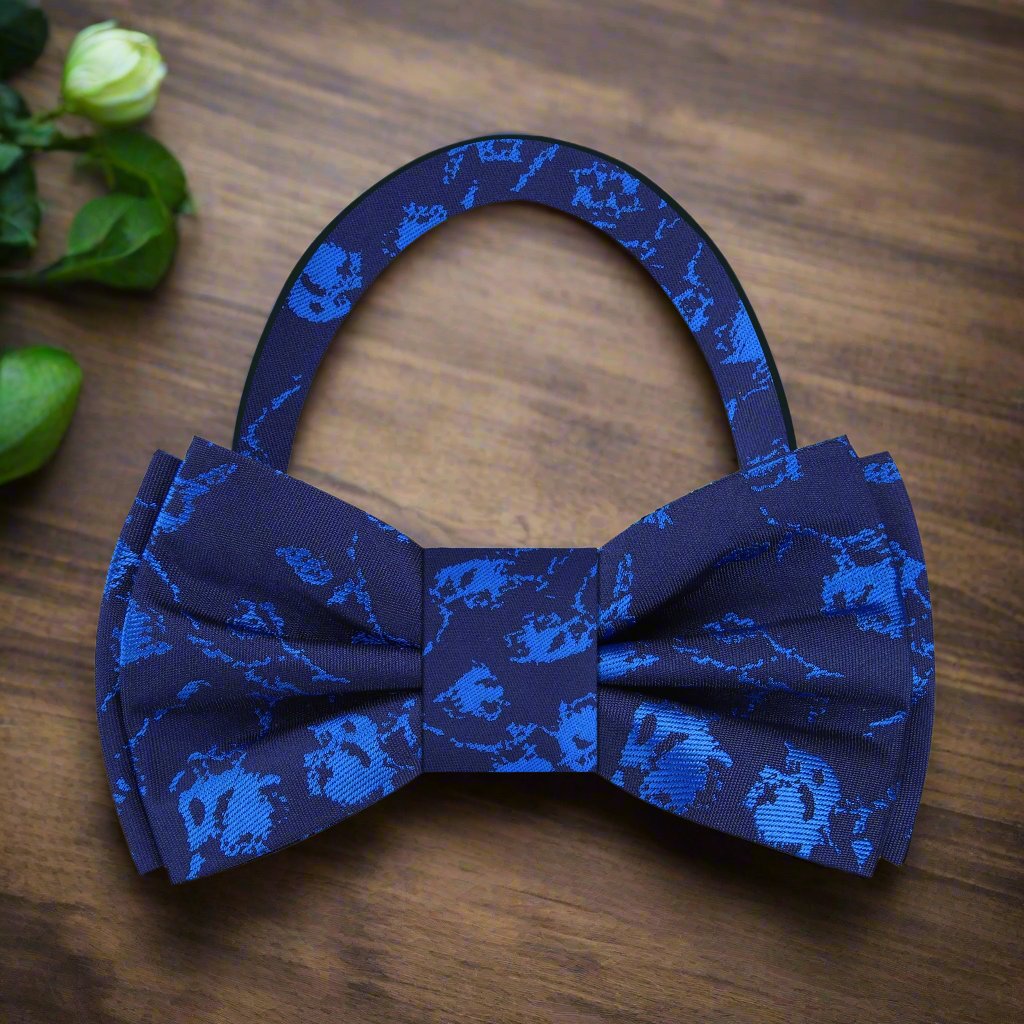 Elegant mens blue silk bow tie styled with a white shirt and suit