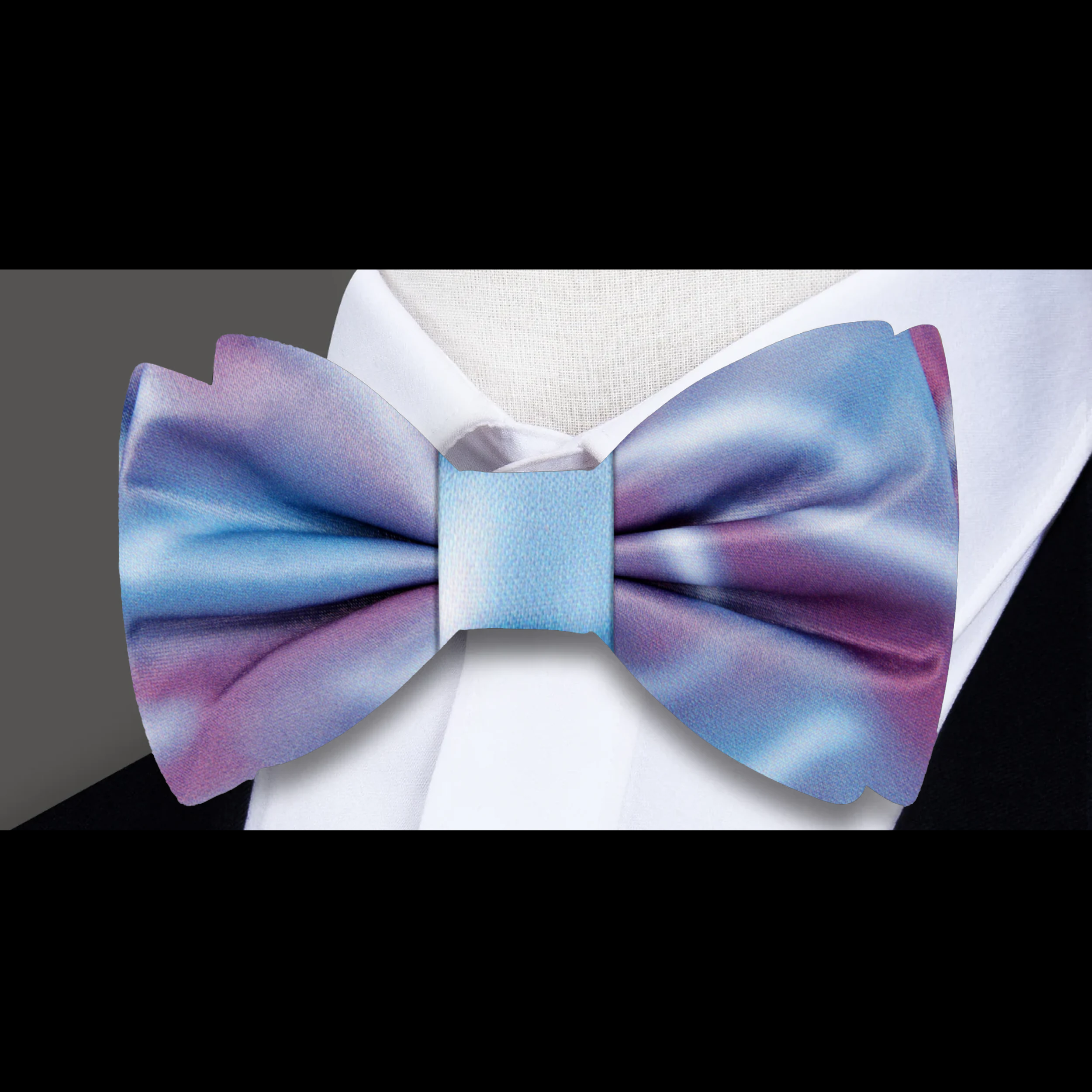 Man wearing a silk bow tie with artistic abstract design at a wedding