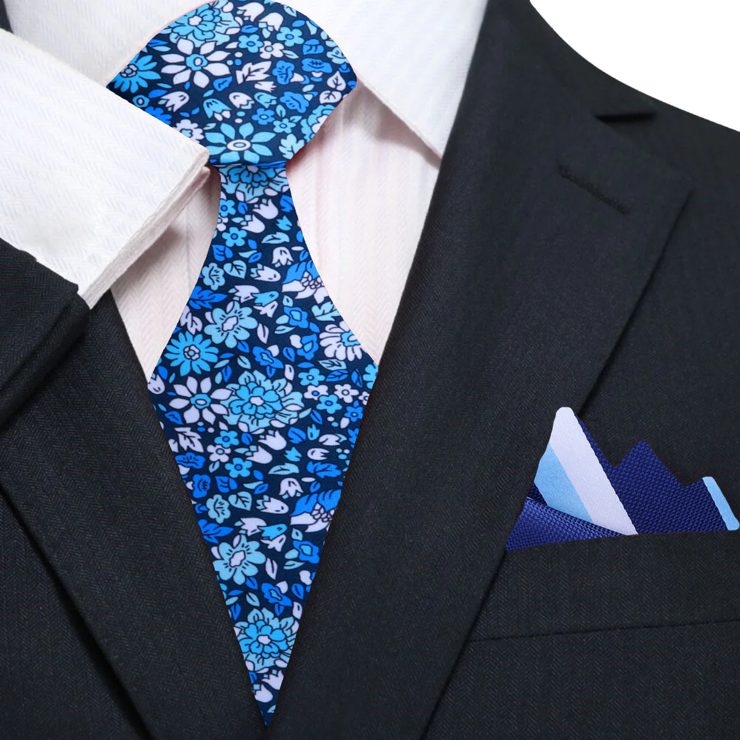 Close-up of the detailed floral design on the silk necktie in shades of blue and white