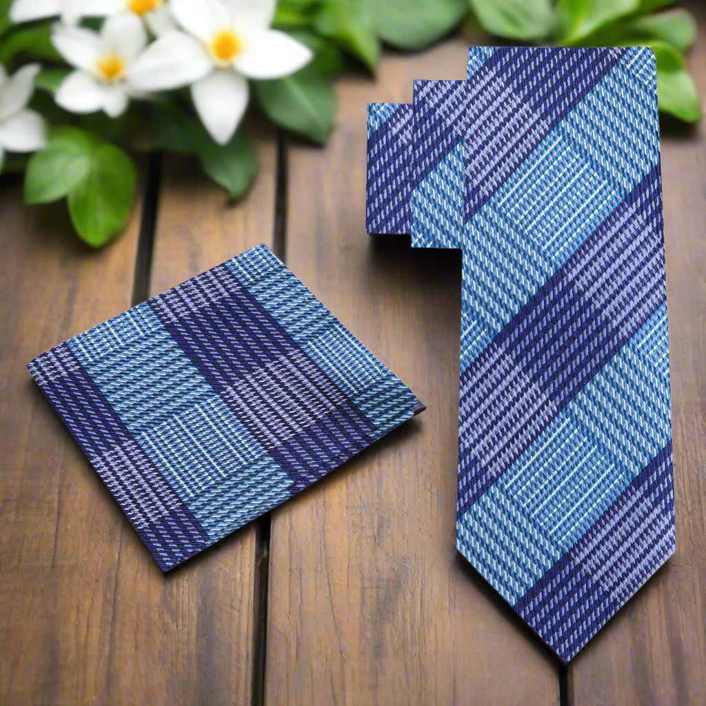 Elegant purple and blue silk plaid tie draped over a white shirt for formal occasions