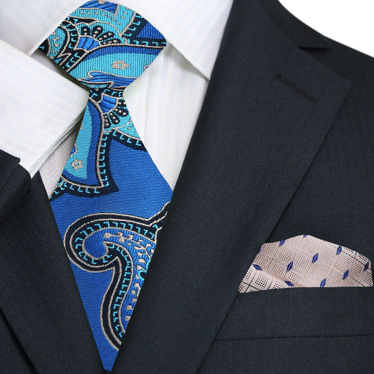 Man wearing a formal blue paisley necktie with a navy suit at a wedding
