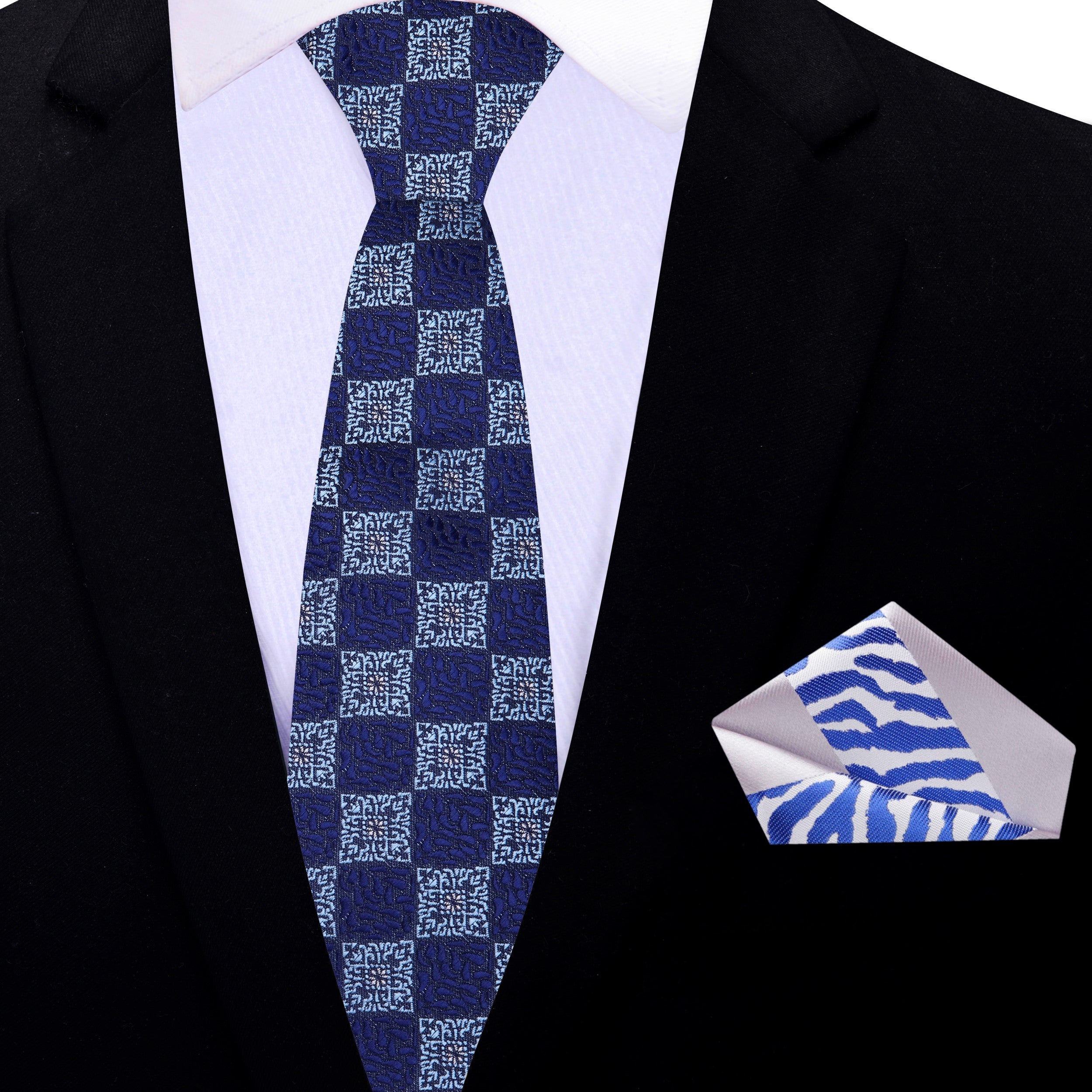 Elegant silk necktie featuring a blue geometric pattern for formal events