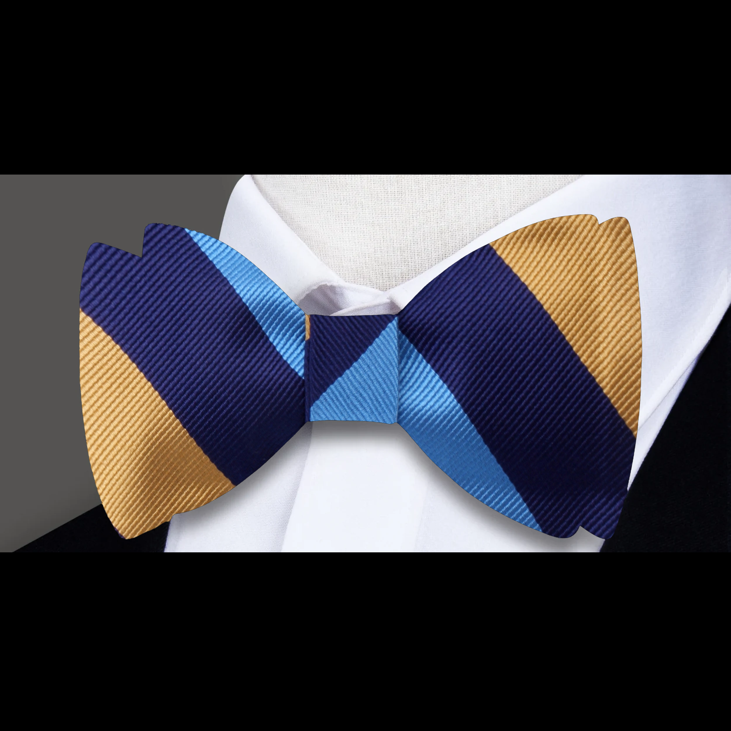 Styled shot of a striped bow tie and matching pocket square for cocktail party outfit