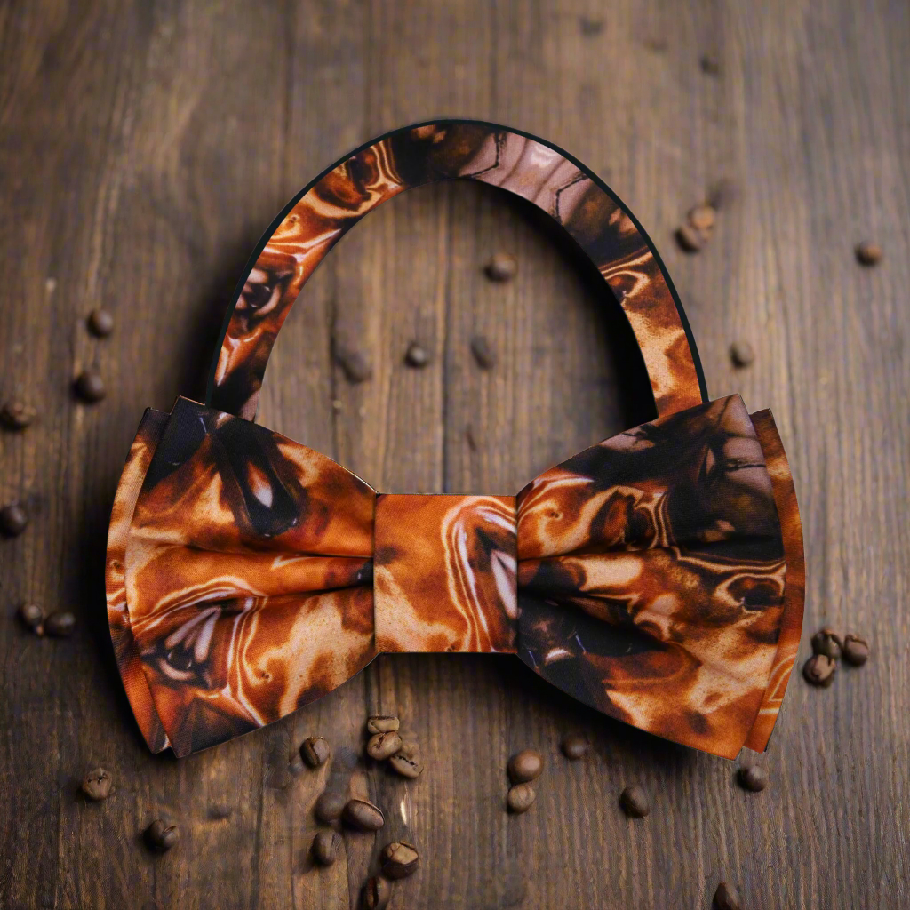 Model wearing a mocha bow tie with matching pocket square during a wedding event.