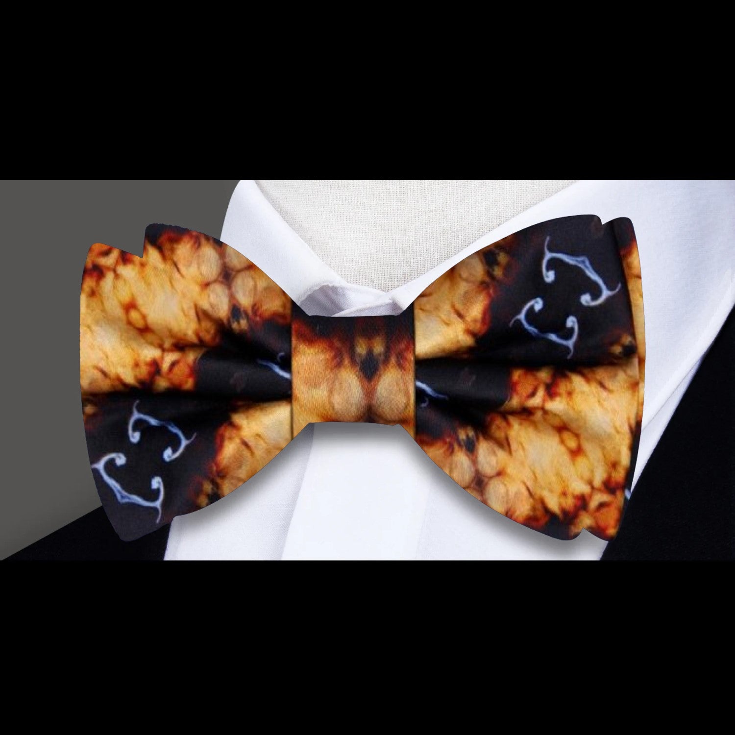 Man wearing a pre-tied brown silk bow tie at formal event